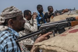 HODEIDAH, YEMEN - SEPTEMBER 21: Fighters from Hodeidah aligned with Yemen's Saudi-led coalition-backed government, looks for Houthi snipers at a frontline south of the city on September 21, 2018 in Hodeidah, Yemen. A coalition military campaign has moved west along Yemen's coast toward Hodeidah, where increasingly bloody battles have killed hundreds since June, putting the country's fragile food supply at risk. (Photo by Andrew Renneisen/Getty Images)