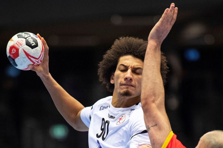 IHF World Men's Handball Championship - Spain v Egypt 2019 - Herning, Denmark - January 26, 2019. Ali Zeinelabedin of Egypt and Joan Canellas Reixach of Spain in action. Ritzau Scanpix/Bo Amstrup via REUTERS ATTENTION EDITORS - THIS IMAGE WAS PROVIDED BY A THIRD PARTY. DENMARK OUT. NO COMMERCIAL OR EDITORIAL SALES IN DENMARK.