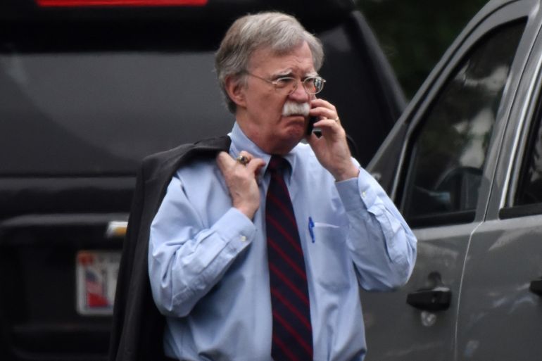 epa07013004 US national security adviser John Bolton speaks on a phone on the South Lawn of the White House, in Washington, DC, USA, 11 September 2018. EPA-EFE/Olivier Douliery / POOL