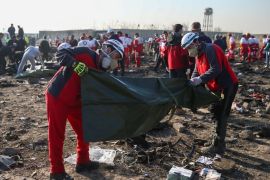 Red Crescent workers check plastic bags at the site where the Ukraine International Airlines plane crashed after take-off from Iran's Imam Khomeini airport, on the outskirts of Tehran, Iran January 8, 2020. Nazanin Tabatabaee/WANA (West Asia News Agency) via REUTERS ATTENTION EDITORS - THIS IMAGE HAS BEEN SUPPLIED BY A THIRD PARTY TPX IMAGES OF THE DAY