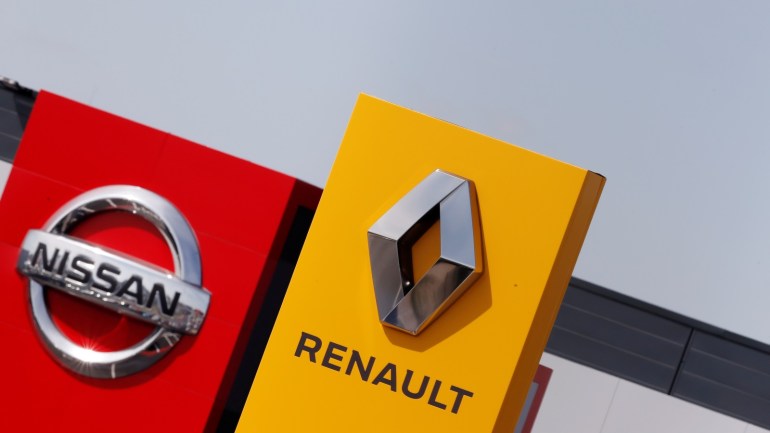 The logos of car manufacturers Renault and Nissan are seen in front of dealerships of the companies in Reims, France, July 9, 2019. REUTERS/Christian Hartmann