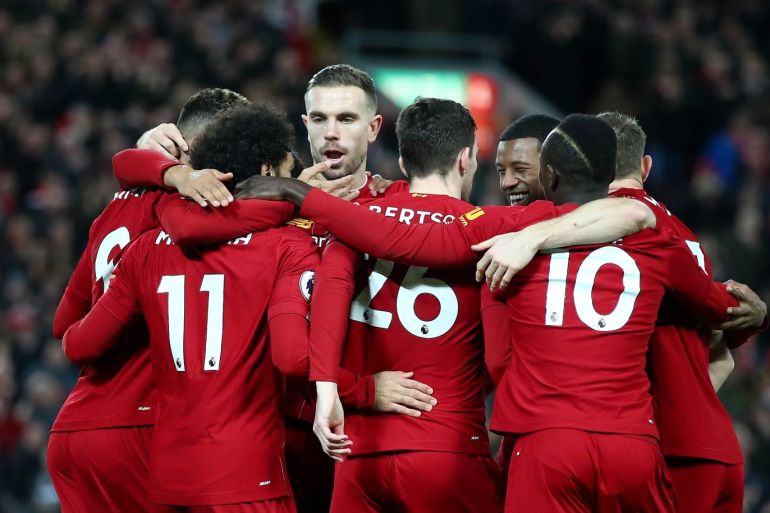 LIVERPOOL, ENGLAND - JANUARY 02: Mohamed Salah of Liverpool celebrates with his team mates after scoring his team's first goal during the Premier League match between Liverpool FC and Sheffield United at Anfield on January 02, 2020 in Liverpool, United Kingdom. (Photo by Clive Brunskill/Getty Images)