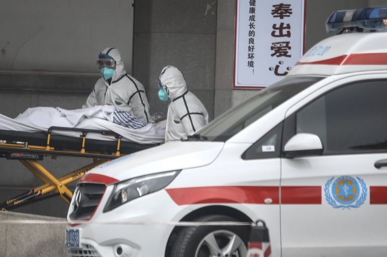 WUHAN, CHINA - JANUARY 17: (CHINA OUT) Medical staff transfer patients to Jin Yintan hospital on January 17, 2020 in Wuhan, Hubei, China. Local authorities have confirmed that a second person in the city has died of a pneumonia-like virus since the outbreak started in December. (Photo by Getty Images)