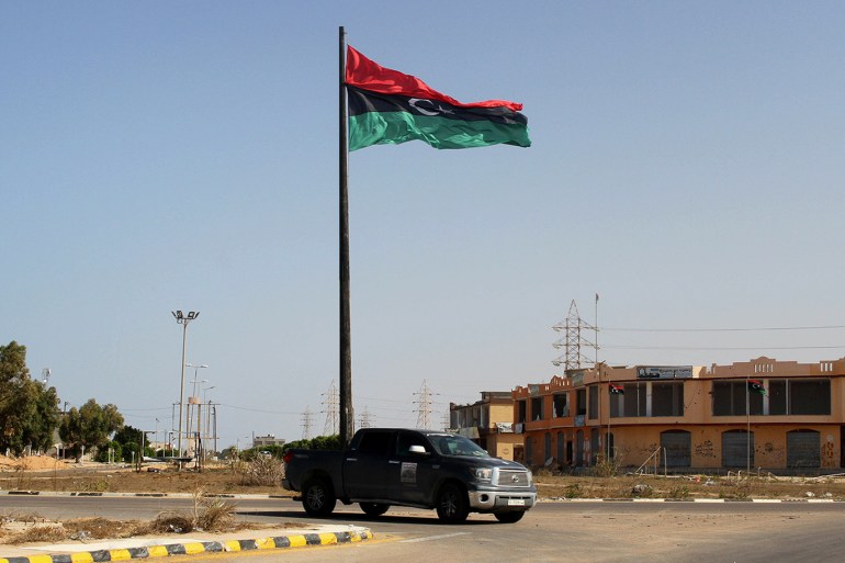 A Libyan flag flies at the entrance of Sirte, Libya October 30, 2016. REUTERS/Hani Amara