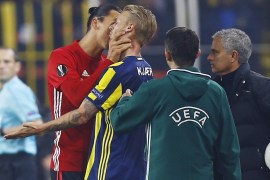 Football Soccer - Fenerbahce SK v Manchester United - UEFA Europa League Group Stage - Group A - SK Sukru Saracoglu Stadium, Istanbul, Turkey - 3/11/16 Manchester United's Zlatan Ibrahimovic clashes with Fenerbahce's Simon Kjaer as manager Jose Mourinho looks on Reuters / Osman Orsal Livepic EDITORIAL USE ONLY.