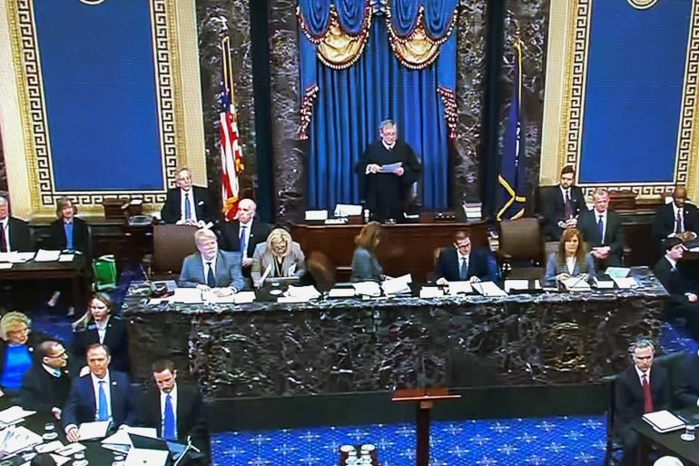 U.S. Supreme Court Chief Justice John Roberts presides over the start of the U.S. Senate impeachment trial of U.S. President Donald Trump as the House impeachment managers sit to one side and the president's legal team sits on the other side in this frame grab from video shot in the U.S. Senate Chamber at the U.S. Capitol in Washington, U.S., January 21, 2020. REUTERS/U.S. Senate TV/Handout via Reuters