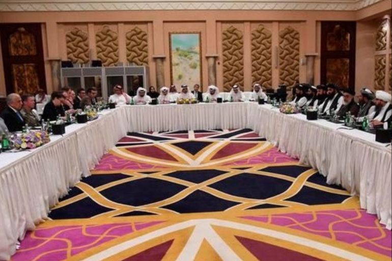 Undated Handout picture of U.S., Taliban and Qatar officials during a meeting for peace talks in Doha, Qatar. Qatari Foreign Ministry/Handout via REUTERS ATTENTION EDITORS - THIS PICTURE WAS PROVIDED BY A THIRD PARTY
