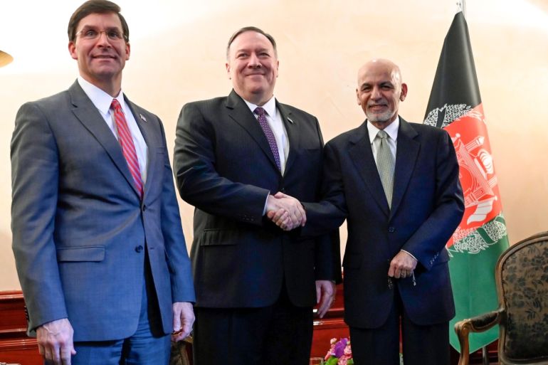 US Secretary of State Mike Pompeo shakes hands with Afghan President Ashraf Ghani (R) as US Secretary of Defense Mark Esper (L) watches during the 56th Munich Security Conference (MSC) in Munich, southern Germany February 14, 2020. Andrew Caballero-Reynolds/Pool via REUTERS
