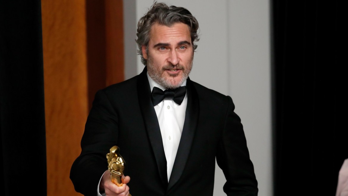 Joaquin Phoenix poses with his Oscar for Best Actor in a Leading Role for “Joker” in the photo room during the 92nd Academy Awards in Hollywood, Los Angeles, California, U.S., February 9, 2020. REUTERS/Lucas Jackson