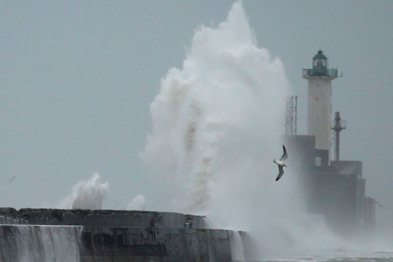 Waves crash against a lighthouse during Storm Ciara at Boulogne-sur-Mer, France, February 9, 2020. REUTERS/Pascal Rossignol