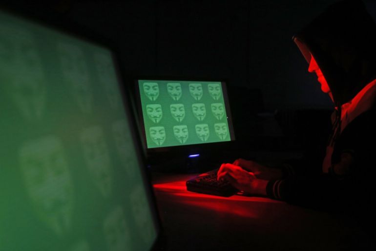 Man poses in front of on a display showing the word 'cyber' in binary code, in this picture illustration taken in Zenica December 27, 2014. A previously undisclosed hacking campaign against military targets in Israel and Europe is probably backed by a country that misused security-testing software to cover its tracks and enhance its capability, researchers said. Picture taken December 27, 2014. REUTERS/Dado Ruvic (BOSNIA AND HERZEGOVINA - Tags: SCIENCE TECHNOLOGY CRIME LAW TPX IMAGES OF THE DAY)