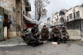 Syrian army soldiers rest in the streets of Maarat al-Numan, Syria, January 30, 2020. REUTERS/Yamam Al Shaar