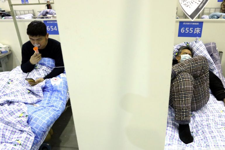 Patients rest on their beds inside the Wuhan Parlor Convention Center that has been converted into a makeshift hospital following an outbreak of the novel coronavirus, in Wuhan, Hubei province, China February 15, 2020. Picture taken February 15, 2020. China Daily via REUTERS ATTENTION EDITORS - THIS IMAGE WAS PROVIDED BY A THIRD PARTY. CHINA OUT.