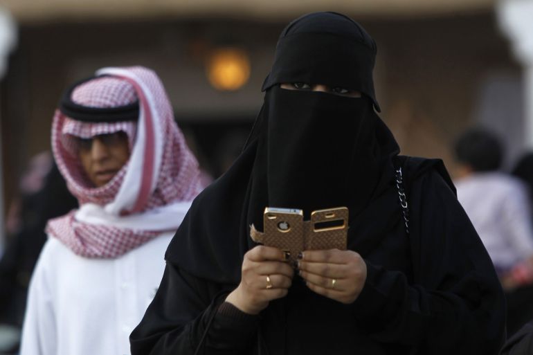 A woman using an iPhone visits the 27th Janadriya festival on the outskirts of Riyadh in this February 13, 2012 file photo. Saudi Telecom Co (STC) is a company with a market capitalisation of $21 billion but no permanent chief executive. It has spent billions of dollars to buy foreign assets, but competitive pressures may force it to focus more on domestic business. Annual profits at Saudi Arabia's biggest telecommunications operator have fallen 43 percent from their 2006 peak, and its part-privatisation has had only limited success in spurring it to make the cost cuts which analysts believe are needed to reverse the slide. REUTERS/Fahad Shadeed/Files (SAUDI ARABIA - Tags: SOCIETY BUSINESS TELECOMS)