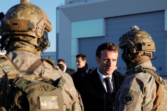 French President Emmanuel Macron talks to soldiers as he visits the 123 Air Base of Orleans-Bricy to give his New Year speech to France's armed forces, in Boulay-les-Barres near Orleans, France January 16, 2020. Cristophe Ena/Pool via REUTERS