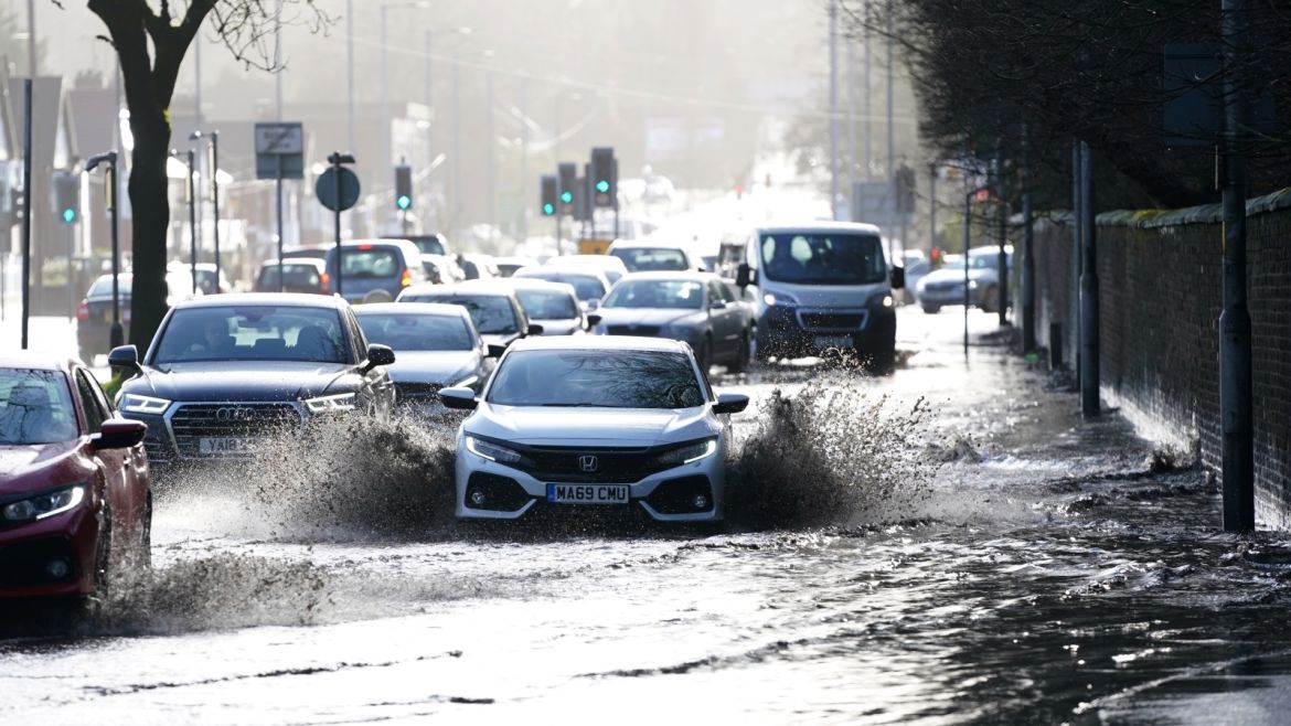 Cars drive through floodwater as hurricane-force winds and rain affected the country's transport network leading to disruptions and prompting warnings of power cuts and a risk to life, in Manchester, Britain February 9, 2020. Storm Ciara has brought heavy rain and winds, caused  widespread flooding and has led to the cancellation of sporting events. REUTERS/Jon Super