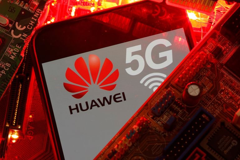 A smartphone with the Huawei and 5G network logo is seen on a PC motherboard in this illustration picture taken January 29, 2020. REUTERS/Dado Ruvic/Illustration