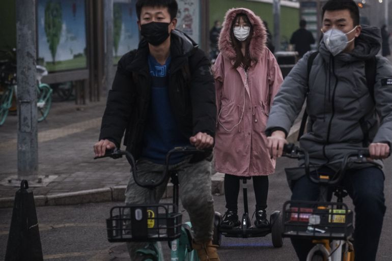 BEIJING, CHINA - FEBRUARY 10- People wear protective masks as they ride in the street during the rush hour on February 10, 2020 in Beijing, China. The number of cases of a deadly new coronavirus rose to more than 40000 in mainland China Monday, days after the World Health Organization (WHO) declared the outbreak a global public health emergency. China continued to lock down the city of Wuhan in an effort to contain the spread of the pneumonia-like disease which medicals