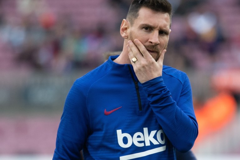 FC Barcelona and Alaves: La Liga- - BARCELONA, SPAIN - DECEMBER 21: Barcelona's Argentinian forward Lionel Messi gestures at warm up during the Spanish League football match FC Barcelona vs Alaves at the Camp Nou stadium in Barcelona on December 21, 2019.