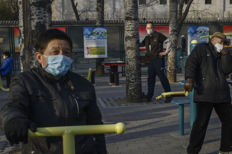 BEIJING, CHINA - FEBRUARY 23: Chinese men wear protective masks as they exercise a t a local park on February 23, 2020 in Beijing, China. The number of cases of the deadly new coronavirus COVID-19 being treated in China was more than 55000 in mainland China Saturday, in what hat the World Health Organization (WHO) has declared a global public health emergency. China continued to lock down the city of Wuhan in an effort to contain the spread of the pneumonia-like disease which medicals experts have confirmed can be passed from human to human. In an unprecedented move, Chinese authorities have maintained and in some cases tightened the travel restrictions on the city which is the epicentre of the virus and also in municipalities in other parts of the country affecting tens of millions of people. The number of those who have died from the virus in China climbed to over 2348 on Saurday mostly in Hubei province, and cases have been reported in other countries including the United States, Canada, Australia, Japan, South Korea, India, the United Kingdom, Germany, France and several others. The World Health Organization has warned all governments to be on alert and screening has been stepped up at airports around the world. Some countries, including the United States, have put restrictions on Chinese travellers entering and advised their citizens against travel to China. (Photo by Kevin Frayer/Getty Images)