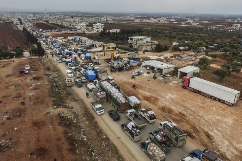Syria: 90.000 civilians flee Idlib over last 4 days- - IDLIB, SYRIA - FEBRUARY 04: A drone photo shows a view of Syrian civilians' convoy, who are being forcibly displaced due to the ongoing attacks carried out by Assad regime, Russia and Iran-backed groups, and are on their way to safer zones with their belongings near Turkish border, in Idlib, Syria on February 5, 2020. The ongoing attacks by Bashar al-Assad regime in Syria and its allies forced civilians to flee the