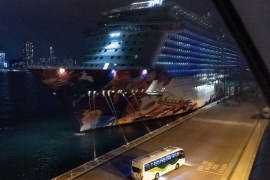 HONG KONG, CHINA - FEBRUARY 09: A bus carrying passengers disembarked from the World Dream cruise ship at Kai Tak Cruise Terminal drives off on February 9, 2020 in Hong Kong, China. 3,600 passengers and crew members quarantined on World Dream cruise ship are finally allowed to disembark after all 1,800 crew members test negative for coronavirus as vessel has been docked at Kai Tak Cruise Terminal for more than four days. (Photo by Anthony Kwan/Getty Images)