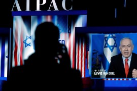 Speaking via satellite feed from Israel, Israeli Prime Minister Benjamin Netanyahu addresses AIPAC in Washington, U.S., March 26, 2019. REUTERS/Kevin Lamarque