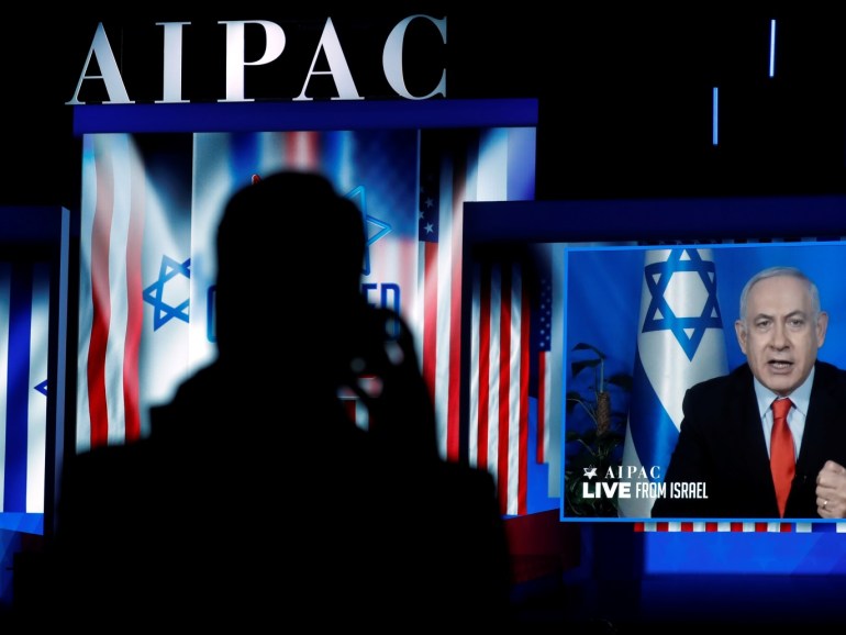 Speaking via satellite feed from Israel, Israeli Prime Minister Benjamin Netanyahu addresses AIPAC in Washington, U.S., March 26, 2019. REUTERS/Kevin Lamarque