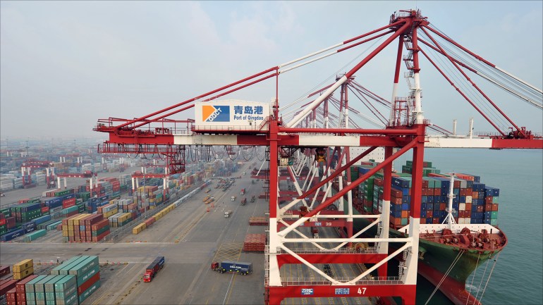 epa05017649 A general view of containers and a ship at the Port of Qingdao, eastern China's Shandong province, China, 09 November 2015. China's foreign trade dropped 9 per cent year on year in October in the eighth consecutive month of decline, official figures showed 08 November. Exports were down 3.6 per cent and imports plunged 16 per cent in October. EPA/STRINGER