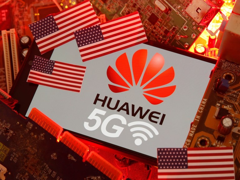 The U.S. flag and a smartphone with the Huawei and 5G network logo are seen on a PC motherboard in this illustration taken January 29, 2020. REUTERS/Dado Ruvic/Illustration