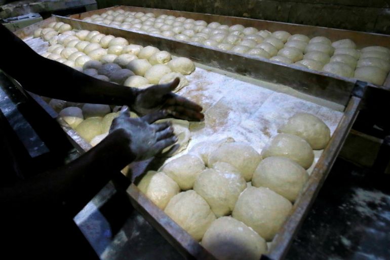 A worker prepares bread dough before baking in a traditional oven at a bakery in Khartoum, Sudan February 16, 2020. Picture taken February 16, 2020. REUTERS/Mohamed Nureldin Abdallah