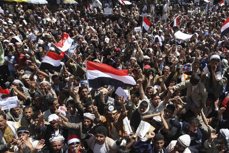 Anti-government protesters shout slogans during a protest demanding the ouster of Yemen's President Ali Abdullah Saleh outside Sanaa University February 28, 2011. Tens of thousands of protesters demanding the end of Saleh's 32-year rule of Yemen joined demonstrations on Monday, while skirmishes in the south killed three soldiers and a policeman. REUTERS/Ammar Awad (YEMEN - Tags: POLITICS CIVIL UNREST)