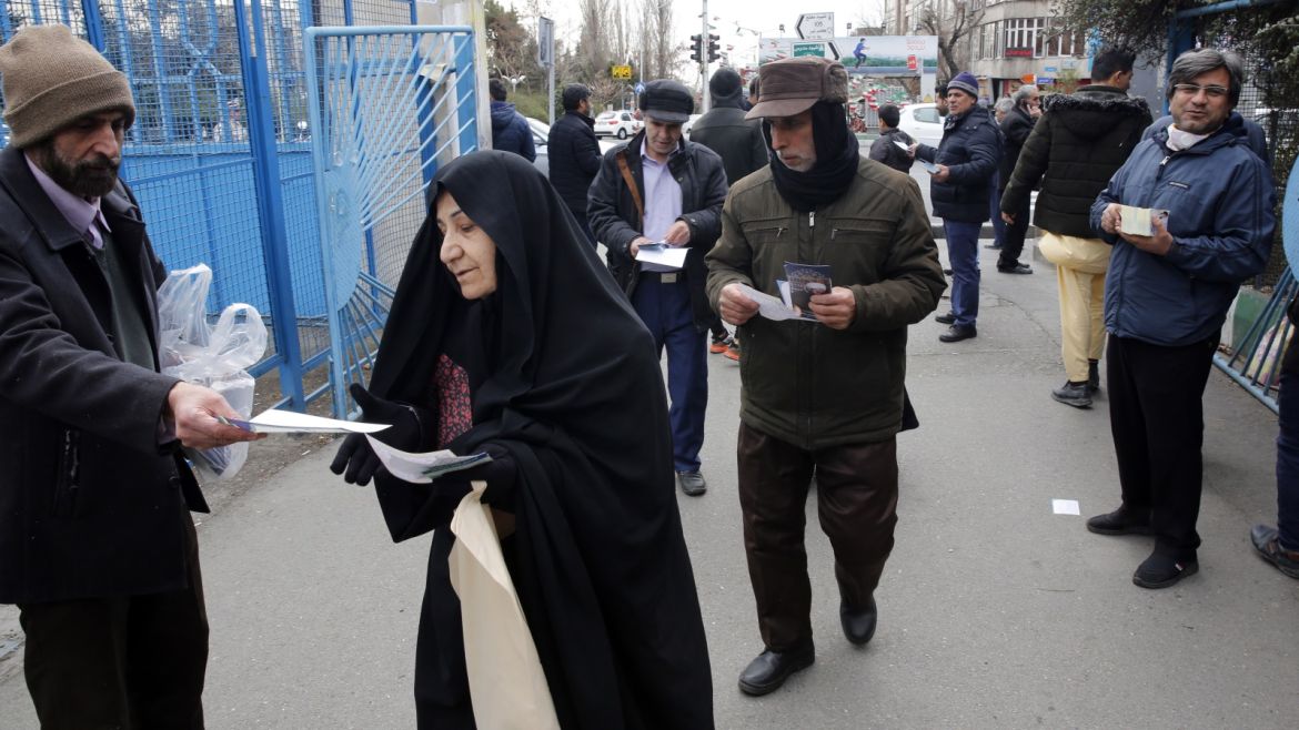 epa08216988 Iranian campaign workers distribute electoral fliers of candidates running in the upcoming parliamentary elections, near the Mosallah Mosque during Friday prayers, in Tehran, Iran, 14 February 2020. Iranians will go to the polls to vote in the parliamentary elections on 21 February 2020. EPA-EFE/ABEDIN TAHERKENAREH