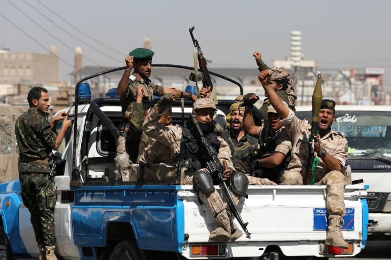 Houthi troops ride on the back of a police patrol truck after participating in a Houthi gathering in Sanaa, Yemen February 19, 2020. REUTERS/Khaled Abdullah