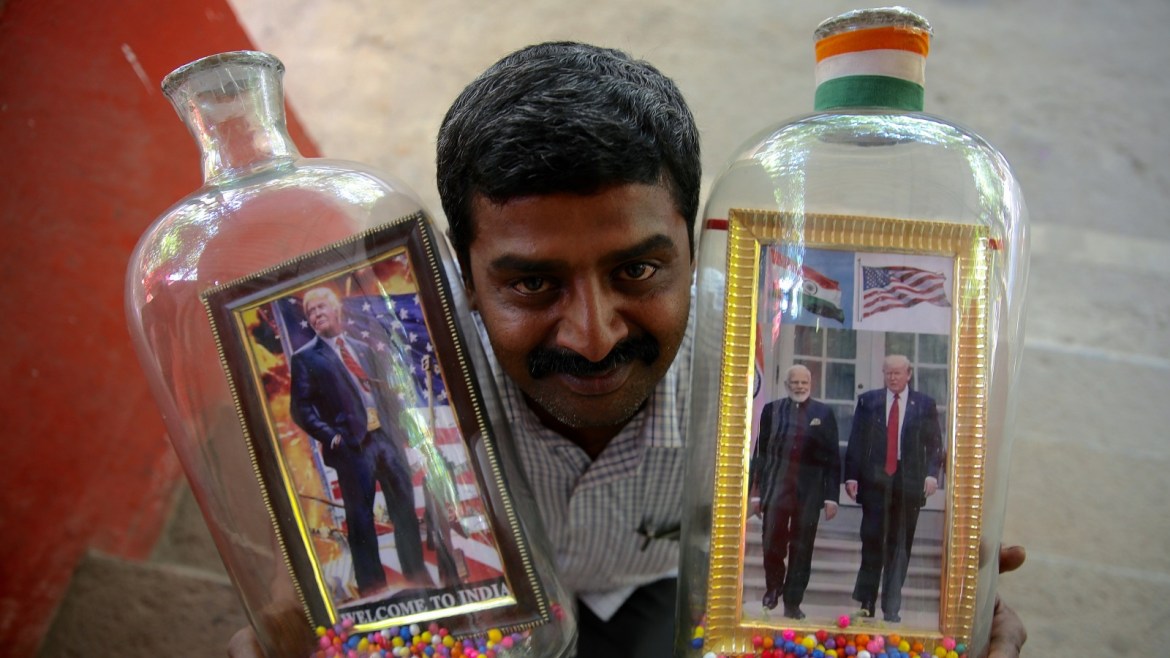 epa08240073 Indian bottle artist Basavaraj displays bottles designed with photos of US President Donald J. Trump and Indian Prime Minister Narendra Modi, in Bangalore, India, 23 February 2020. The bottle artist Basavaraj put photos in 10liter bottle, ahead of Trump's upcoming visit to India on 24 to 25 February 2020. EPA-EFE/JAGADEESH NV