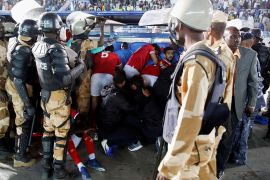 Sudanese riot policemen secure soccer players from fans during a match between Sudanese team Al Hilal against Egypt’s Al Ahly in Group C at the African Champions League at the Al-Jawhara Stadium in Khartoum, Sudan February 1, 2020. REUTERS/Mohamed Nuredin Abdallah