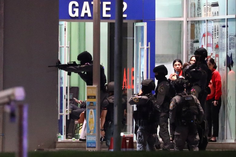 Thailand security forces enter in a shopping mall as they chase a shooter hidden in after a mass shooting in front of the Terminal 21, in Nakhon Ratchasima, Thailand February 9, 2020. REUTERS/Athit Perawongmetha