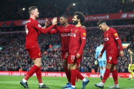 LIVERPOOL, ENGLAND - FEBRUARY 01: Mohamed Salah of Liverpool celebrates with Georginio Wijnaldum, Jordan Henderson and Roberto Firmino after scoring his team's third goal during the Premier League match between Liverpool FC and Southampton FC at Anfield on February 01, 2020 in Liverpool, United Kingdom. (Photo by Julian Finney/Getty Images)