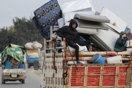 Internally displaced people, who fled from Idlib, ride on a pick up truck with their belongings in Azaz, Syria February 15, 2020. REUTERS/Khalil Ashawi