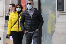 Coronavirus cases reach 1140 in UK- - LONDON, UNITED KINGDOM - MARCH 14: People wear medical masks as a precaution against coronavirus (COVID-19) in central London, United Kingdom on March 14, 2020. Today the total number of coronavirus cases reached 1140 and total number of deaths has risen to 21 almost doubling in last 24 hours.