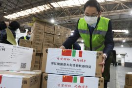 Staff members move medical supplies to be sent to Italy for the prevention of the novel coronavirus, following the coronavirus outbreak, at a logistics center of the international airport in Hangzhou, Zhejiang province, China March 10, 2020. Picture taken March 10, 2020. China Daily via REUTERS ATTENTION EDITORS - THIS IMAGE WAS PROVIDED BY A THIRD PARTY. CHINA OUT.