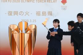 IWAKI, JAPAN - MARCH 25: The Olympic flame is lit at the cauldron during the 'Flame of Recovery' special exhibition ceremony at Aquamarine Park a day after the postponement of the Tokyo 2020 Olympic and Paralympic Games announced due to the coronavirus pandemic on March 25, 2020 in Iwaki, Fukushima, Japan. (Photo by Clive Rose/Getty Images)