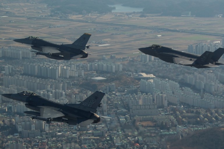 A U.S. Air Force F-35A Lightning II assigned to Hill Air Force Base, Utah, conducts a training flight with F-16 Fighting Falcons assigned to Kunsan Air Base, South Korea over the city of Gunsan, in South Korea on December 1, 2017 in this U.S. Air Force photo and made available on December 5, 2017. Picture taken on December 1, 2017. Courtesy Josh Rosales/U.S. Air Force/Handout via REUTERS ATTENTION EDITORS - THIS IMAGE HAS BEEN SUPPLIED BY A THIRD PARTY.
