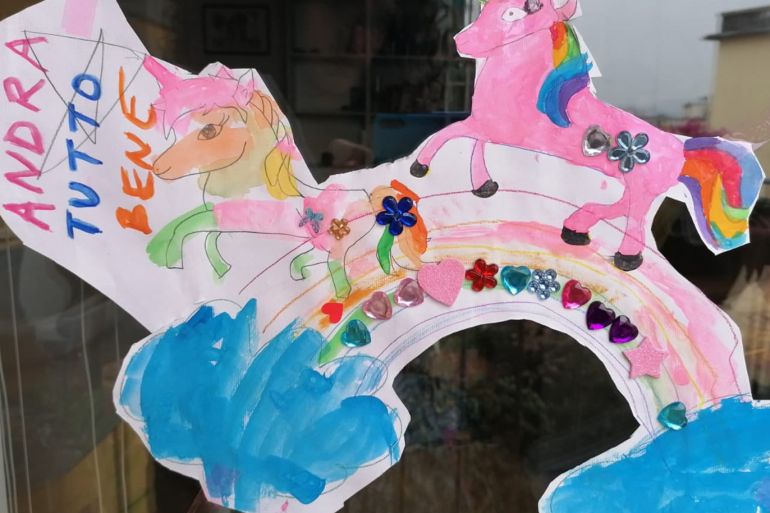 A child’s drawing in a window in Florence. Photograph: Marta Achler/Guardian Community