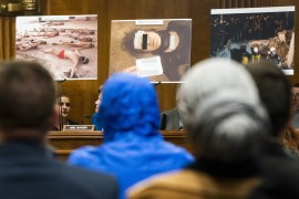 epa08286245 A Syrian military photographer using the pseudonym ‘Ceasar,’ and who defected from the Assad regime, wears a blue hood to keep his anonymity as he testifies before a Senate Foreign Relations Committee hearing called ‘Nine Years of...