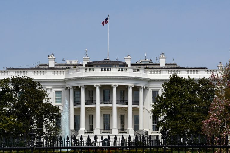 WASHINGTON, D.C. - APRIL 22, 2018:  An American flag flies over the south facade of the White House in Washington, D.C. Additional security fences and barriers were added along the south perimeter to prevent people from jumping the fence and entering the restricted White House grounds. The Secret Service tightened the security on the south side in 2017 by closing access to the entire fence line on the South Lawn. (Photo by Robert Alexander/Getty Images)