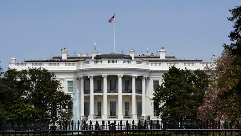 WASHINGTON, D.C. - APRIL 22, 2018: An American flag flies over the south facade of the White House in Washington, D.C. Additional security fences and barriers were added along the south perimeter to prevent people from jumping the fence and entering the restricted White House grounds. The Secret Service tightened the security on the south side in 2017 by closing access to the entire fence line on the South Lawn. (Photo by Robert Alexander/Getty Images)