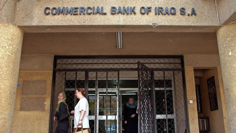 Iraqi bank employees leave a looted Bank in downtown Baghdad, Iraq, Thursday 08 May 2003. US officials claim Saddam's family and henchmen looted nearly one billion dollars in cash from Iraq's central bank shortly before war started. EPA PHOTO EPA / VALDRIN XHEMAJ