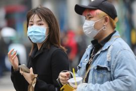 Coronavirus cases rise to 319 in UK- - LONDON, UNITED KINGDOM - MARCH 09: People wear medical masks as a precaution against coronavirus in central London, United Kingdom on March 09, 2020. The total number of coronavirus cases has reached 319 with the death toll of 4 in the UK .