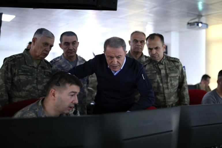 Turkish National Defense Minister Hulusi Akar- - HATAY, TURKEY - FEBRUARY 28: Turkish National Defense Minister Hulusi Akar and commanders-in-chief of armed forces inspect the operation by ground and air support units against Assad regime targets in Idlib from a center in Turkey’s Hatay province, bordering Syria on February 28, 2020.